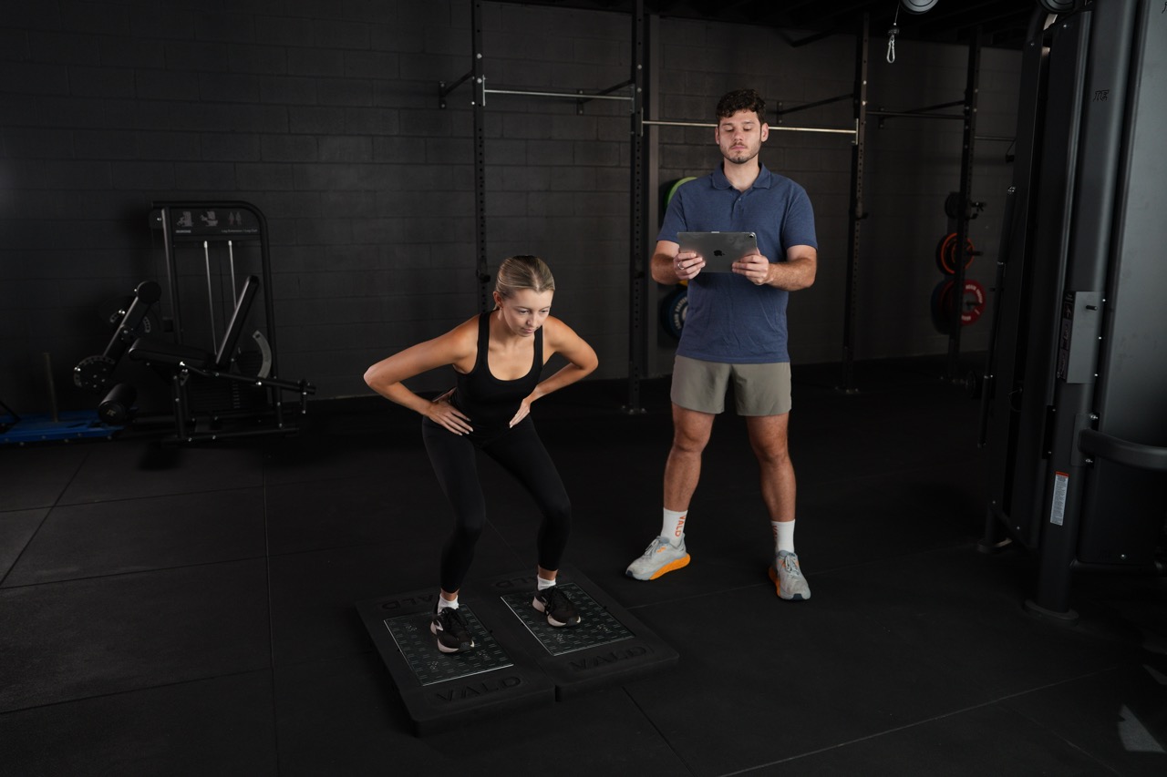 Patient undergoing strength and movement testing at Assure Health in Carryduff, Belfast